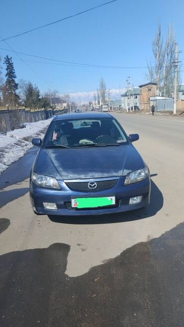 одноместная машина: Mazda 323: 2002 г., 1.6 л, Автомат, Бензин, Хетчбек