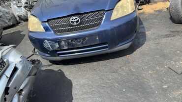 арзан машина мерс: Автомобиль Toyota Corolla синего цвета с характерной решеткой