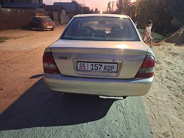 90: Mazda 323: 2000 г., 1.5 л, Автомат, Бензин, Седан — 7