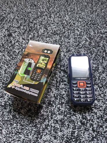 Другие мобильные телефоны: Продаю 2-х симочный кнопочник Land Rover с мощной батареей. Повербанк