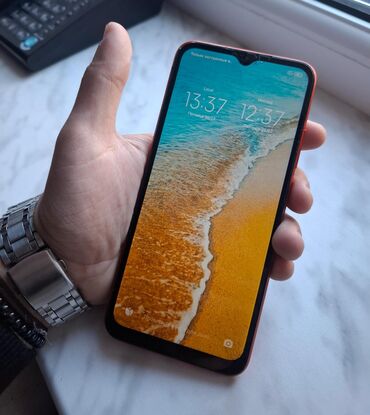 телефон fly iq446: Xiaomi Redmi 9C, 32 ГБ, цвет - Оранжевый, 
 Отпечаток пальца