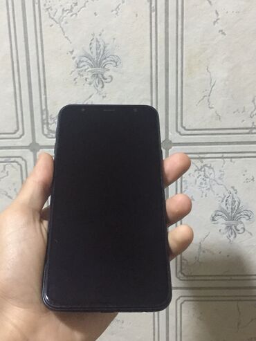 sq90 телефон: Samsung Galaxy J4 Plus, 32 ГБ, цвет - Черный, Две SIM карты