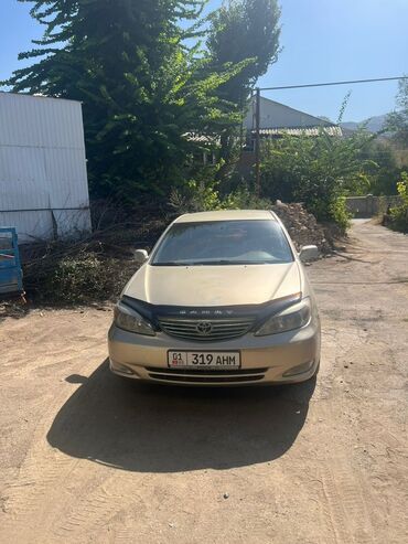 тойота камри сороковка: Седан Toyota Camry золотистого цвета. Автомобиль имеет классический