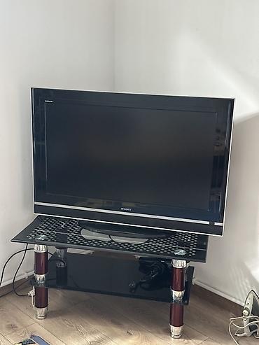 ТВ и видео: Телевизор Sony Bravia с плоским экраном на стеклянной тумбе. Основные — 1