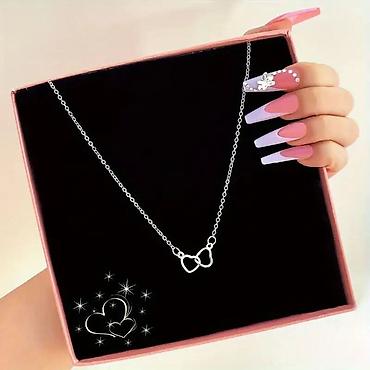 Ogrlice: Ogrlica sa dva isprepletena srca
1300 din — 5