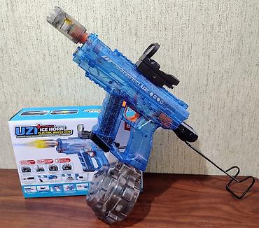 inkişaf etdirici oyuncaqlar: ● Bu, "Uzi Ice Horn" modeli olan elektrikli su tapançasıdır ● Tapança — 4