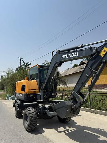 экскаватор w60: Колесный экскаватор Hyundai HW60ECO в желто-серой цветовой гамме — 3