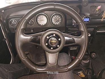 kamaz 55111 satilir: MOMO Pro sükan çarxı - Üçşüalı dizayn, klassik MOMO mərkəz qapağı ilə — 1
