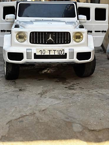 ugg bakü: Uşaqlar üçün elektrikli avtomobil – ağ rəngdə G‑klass üslublu SUV — 1