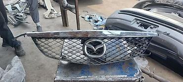 Решетки радиатора: Решетка радиатора Mazda Оригинал — 2
