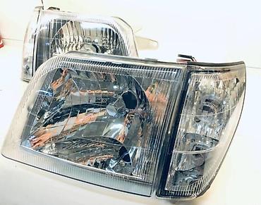 cruser: Комплект передних фар Toyota 2001 г., Новый, Аналог — 2