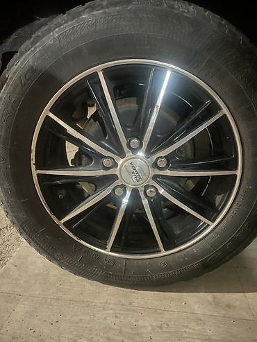зеркало 30: Колесо в сборе: шина 195/65 R15 91T на литом диске+ 2 зимние шины - — 2