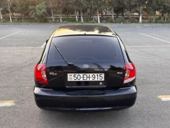 Kia: Kia Rio RS, qara rəng, hetçbek gövdə. Əsas xüsusiyyətlər: - 5 qapılı — 9