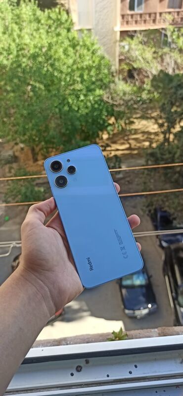 telefon almaq: Xiaomi Redmi 12, 128 ГБ, цвет - Голубой, 
 Гарантия, Отпечаток пальца