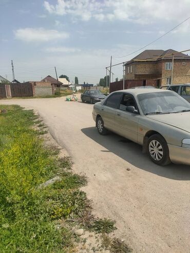 радиатор газ 52: Mazda Cronos: 1992 г., 2 л, Механика, Бензин, Седан