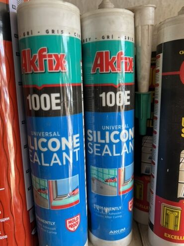 Сухие смеси и грунтовка: Универсальный силиконовый герметик Akfix 100E, предназначенный для