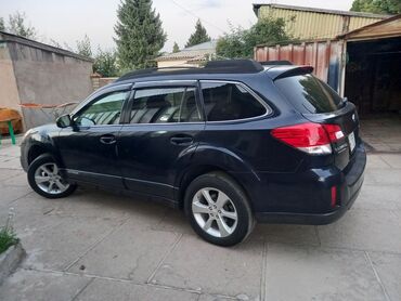 авто в следующем выкупом: Полноприводный кроссовер Subaru Outback глубокого синего цвета. Модель