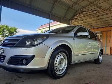 фольксваген тигуан л с: Opel Astra 1.3 turbo dizel (universal) – gümüşü rəngdə, 5 qapılı — 1