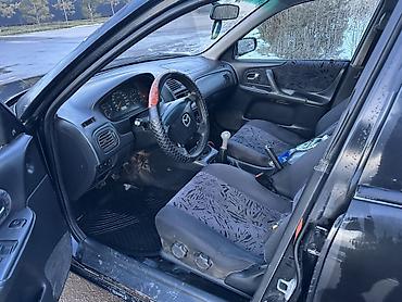 Mazda: Mazda 323: 2000 г., 1.8 л, Механика, Бензин, Универсал — 8