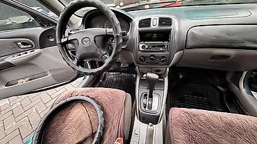 Mazda: Mazda 323: 2003 г., 1.6 л, Автомат, Бензин, Универсал — 10