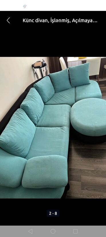 Mavi rəngdə, rahat oturacaqları və geniş dizaynı ilə künc divan dəsti