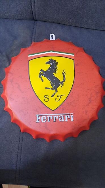 Ferrari: "Ferrari" yazılı, qapaq şəkilli metal lövhə. Yenidir. Diametri: 35sm — 10