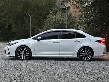 byd e6: Toyota Corolla: 2019 г., 1.8 л, Вариатор, Гибрид, Седан — 1