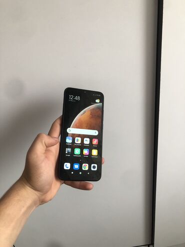 Xiaomi: Xiaomi Redmi 9C, 128 ГБ, цвет - Черный, 
 Сенсорный, Отпечаток пальца, Беспроводная зарядка