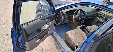 mazda 323 (bh): Mazda 323: 2002 г., 1.8 л, Механика, Бензин, Хэтчбэк — 6
