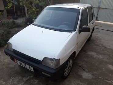 Daewoo: Компактный пятидверный хэтчбек белого цвета. Основные характеристики