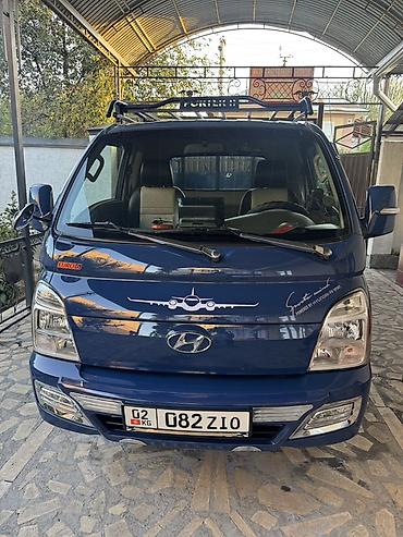 ресор на портер: Hyundai Porter II — компактный грузовик (бортовой) синего цвета — 2