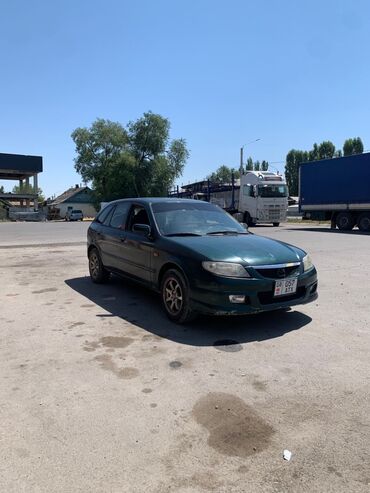 старые машины: Mazda Familia: 2002 г., 1.6 л, Механика, Бензин, Хетчбек