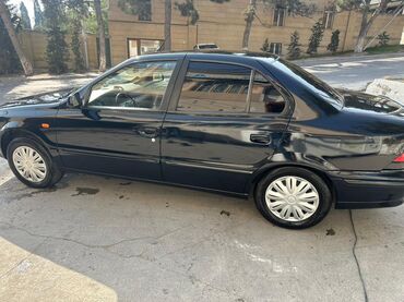 Iran Khodro: İran Khodro Samand (sedan), qara rəng. Xüsusiyyətlər: - Kuzov: 4 — 5