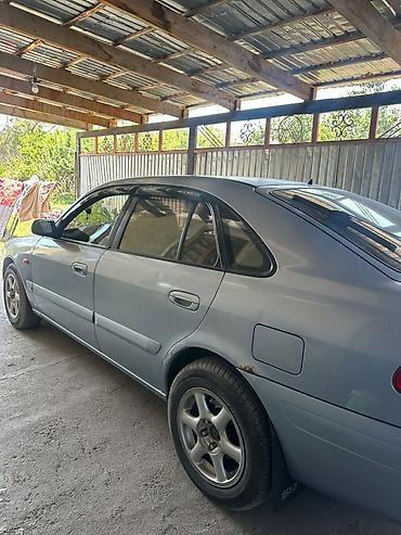 Унаа сатуу: Mazda 626: 2000 г., 2 л, Кол менен иштөөчү, Бензин, Хетчбек — 9