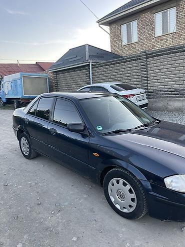 машинка б у: Mazda 323: 1999 г., 1.6 л, Механика, Бензин, Седан — 10