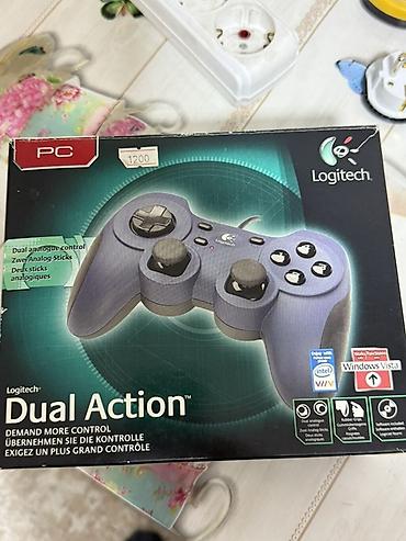 nintendo controller: Logitech Dual Action — проводной геймпад для ПК и Mac. Особенности: - — 1