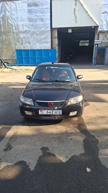 mazda 2000: Mazda 323: 2002 г., 1.6 л, Механика, Бензин, Универсал — 1