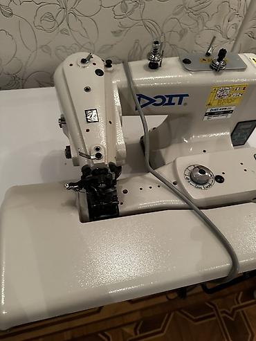 tikis isi: Sənaye tikiş maşını – DOIT DDL-8700 tipli (etiketdə “DOIT” loqosu — 2