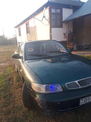 Daewoo: Model: Daewoo Nubira (sedan) Rəng: Tünd yaşıl Yanacaq növü: Benzin — 10