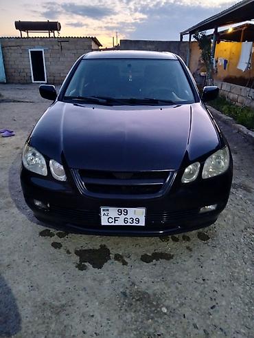misin: Mitsubishi universal kuzovlu minik avtomobil. Qara rəngdə olan bu — 2