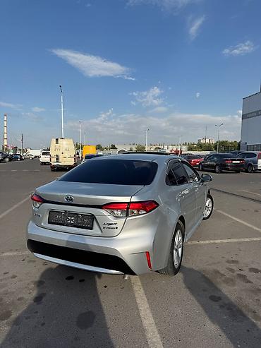электромот: Toyota Corolla: 2021 г., Гибрид, Седан — 6