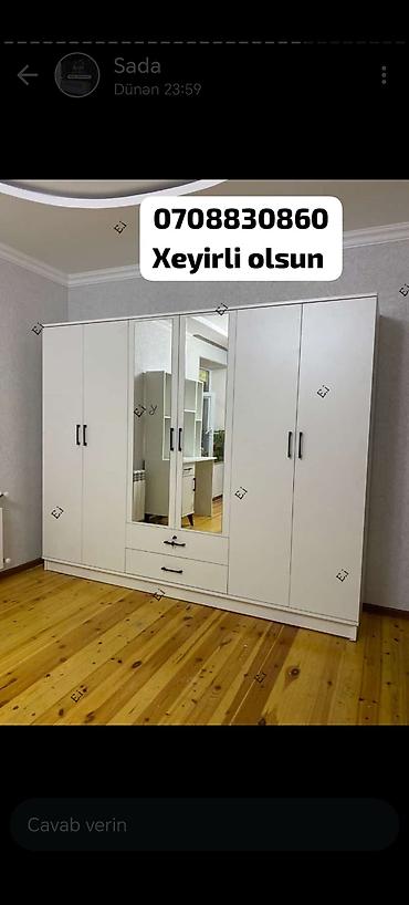 seyfi qapi: Daxili rəflər və asma yerləri olan, ağ rəngdə qarderob. Qarderobun — 9