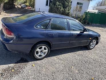 ом 422: Mazda Cronos: 1994 г., Седан — 5
