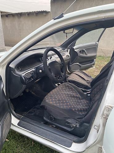 пинин ио: Mazda Cronos: 1994 г., Механика, Бензин, Седан — 8
