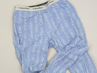 legginsy ze srebrnym lampasem: Legginsy dziecięce, Calvin Klein, 7 lat, 116/122, stan - Dobry