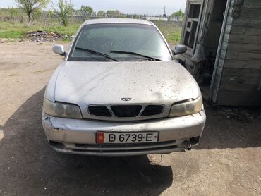 хундай елентро: Автомобиль Daewoo серебристого цвета с характерной решеткой радиатора