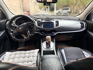 su radiatoru: Kia Sportage, ağ rəng, kompakt krossover. Güclü və qənaətcil — 8