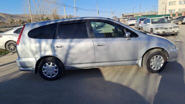 хонда стрим обсолют: Минивэн Honda Stream серебристого цвета, представленный на