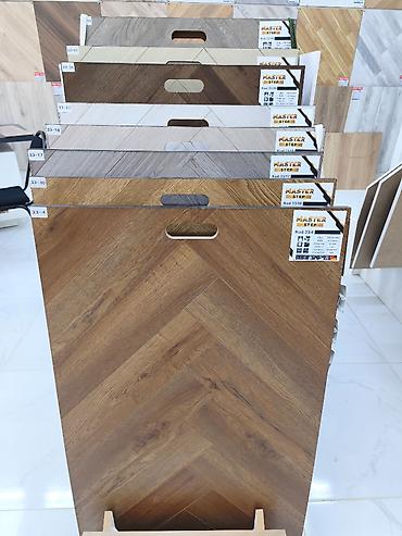 Master Step laminat kolleksiyası – balıqquyruğu (chevron) naxışlı