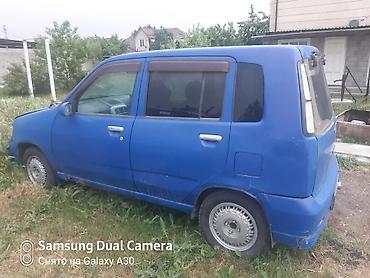 араб 2 бака: Nissan Cube (кузов Z10), правый руль, хэтчбек 5‑дверный. Цвет синий — 7